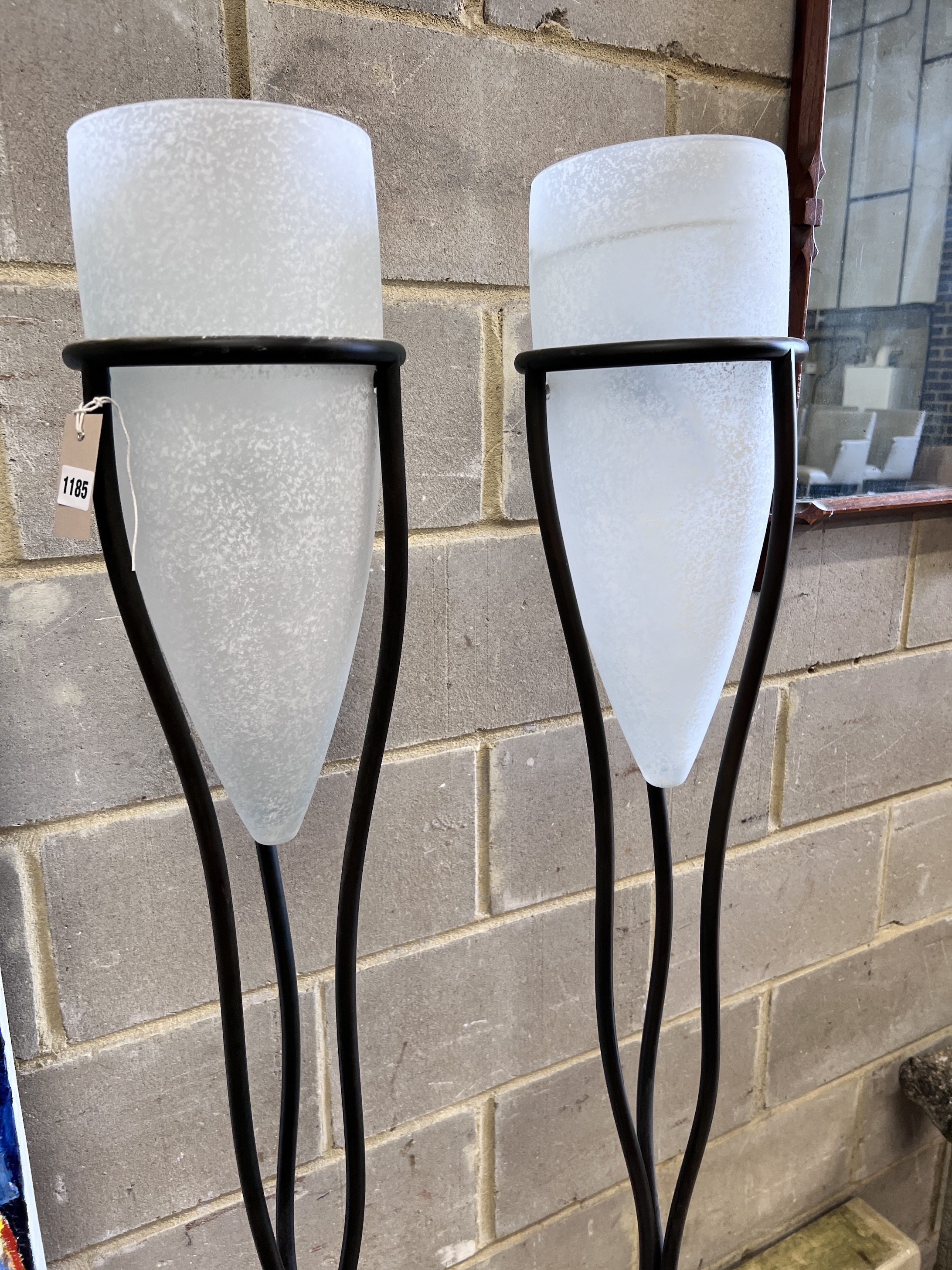 A pair of tubular metal and frosted glass standard lamps, height 187cm